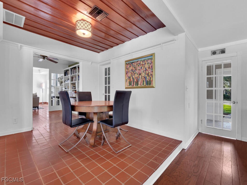 1803 Ardmore Road Fort Myers, FL 33901 - Photo 10 of 39 a workspace with furniture and wooden floor