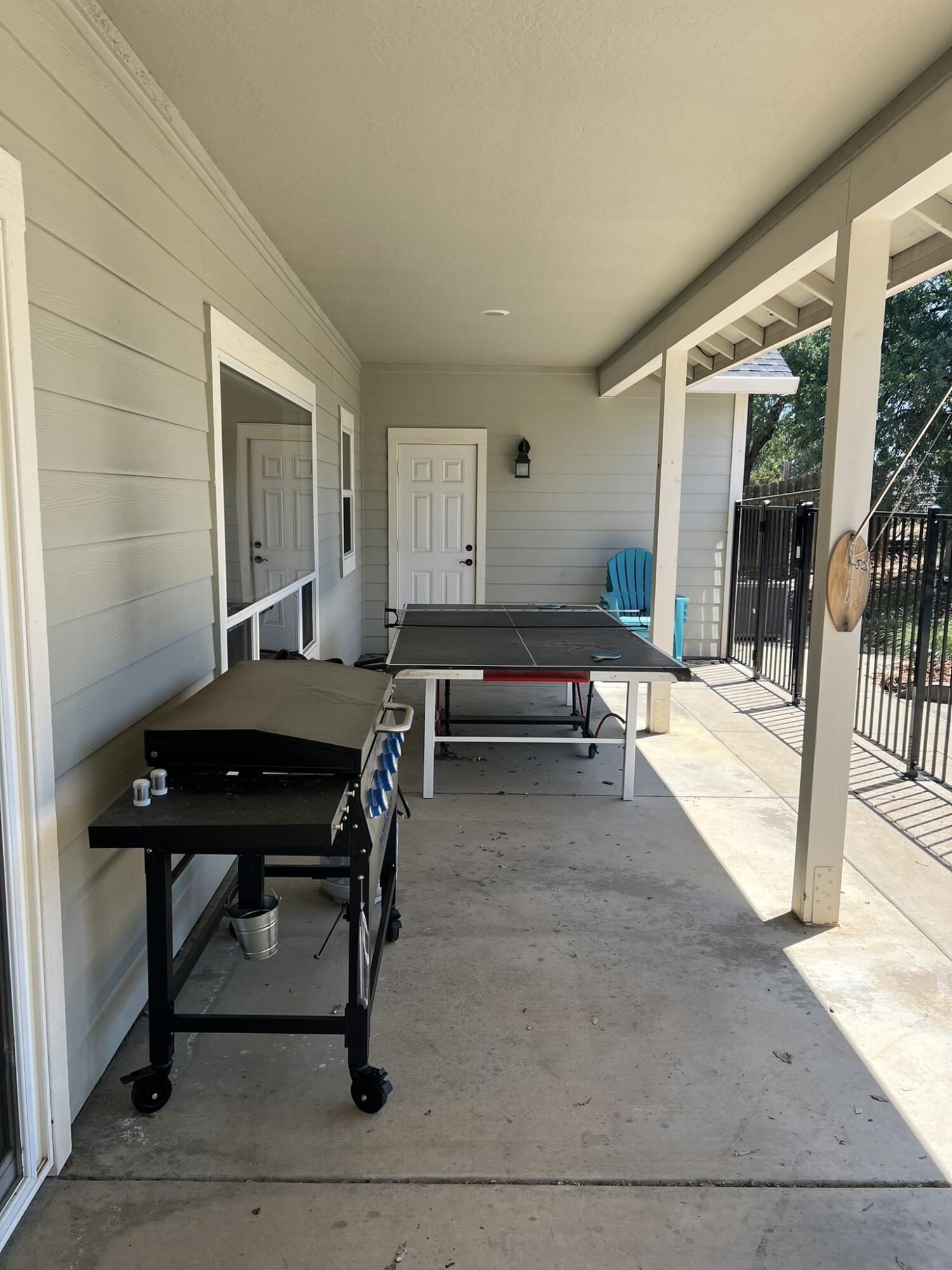 20901 Old 44 Drive Redding, CA 96003 - Photo 17 of 59 a living room with furniture a table and a piano next to a window
