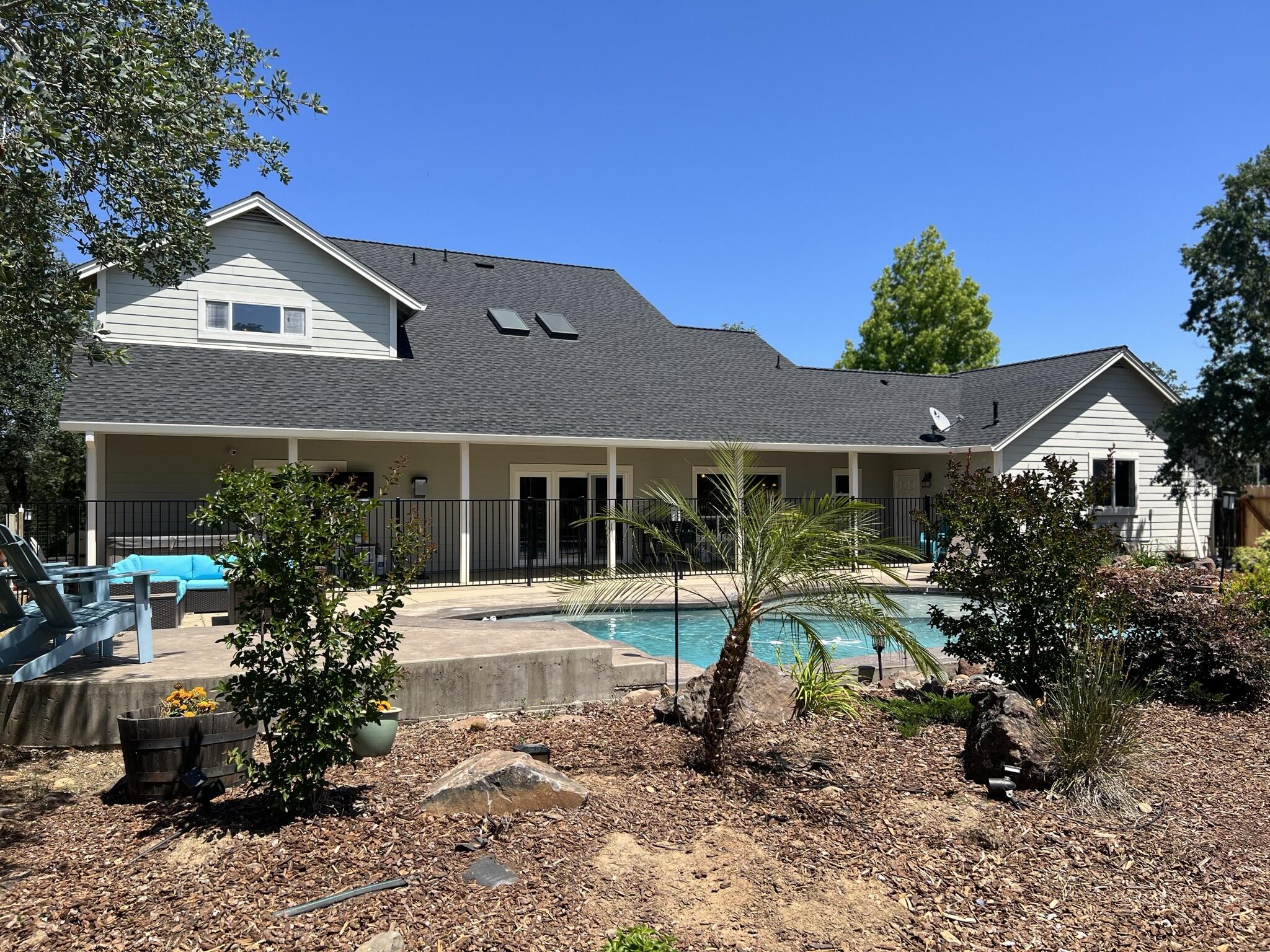 20901 Old 44 Drive Redding, CA 96003 - Photo 24 of 59 a front view of a house with garden