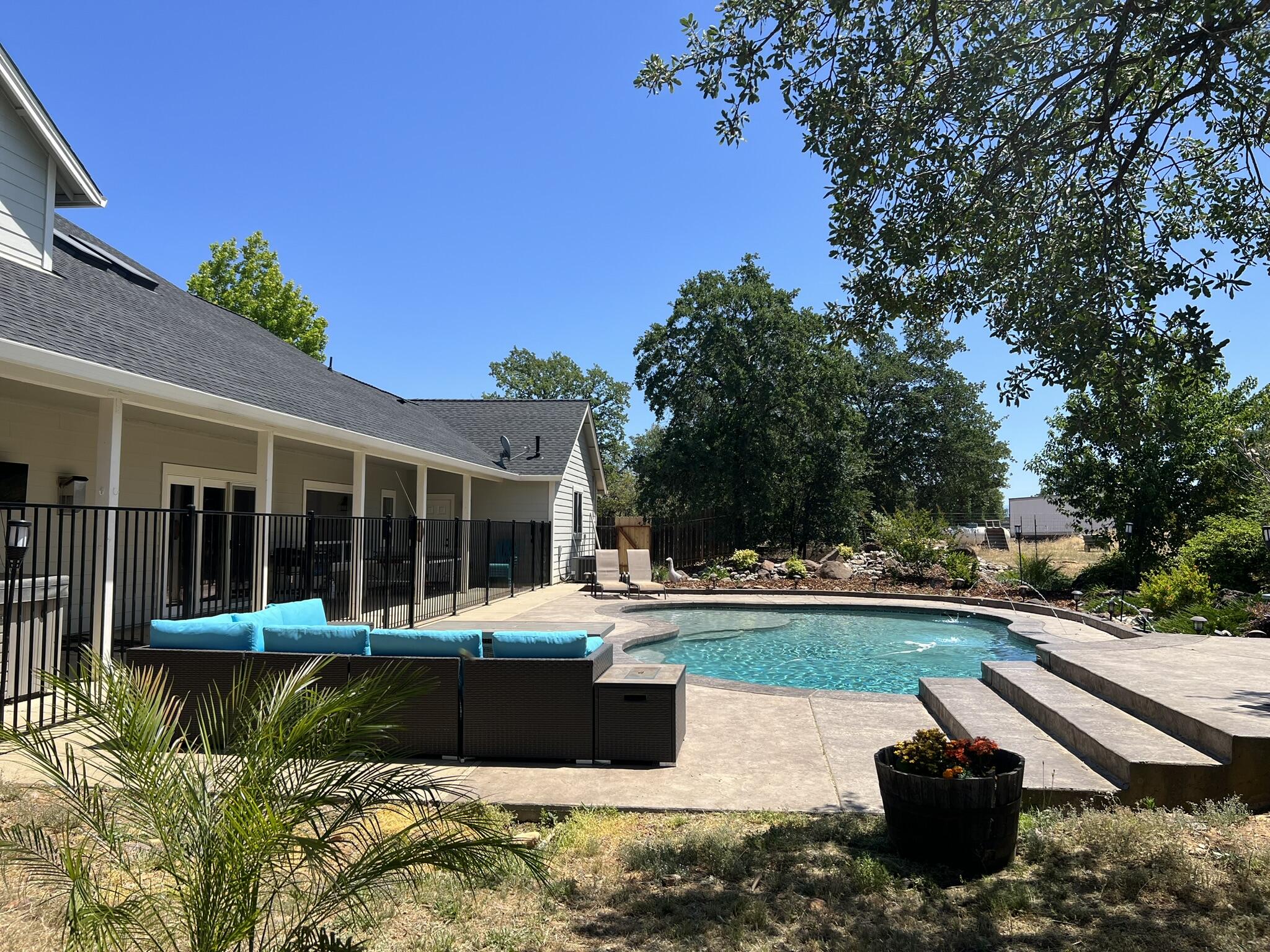 20901 Old 44 Drive Redding, CA 96003 - Photo 25 of 59 a view of a house with swimming pool and porch with furniture