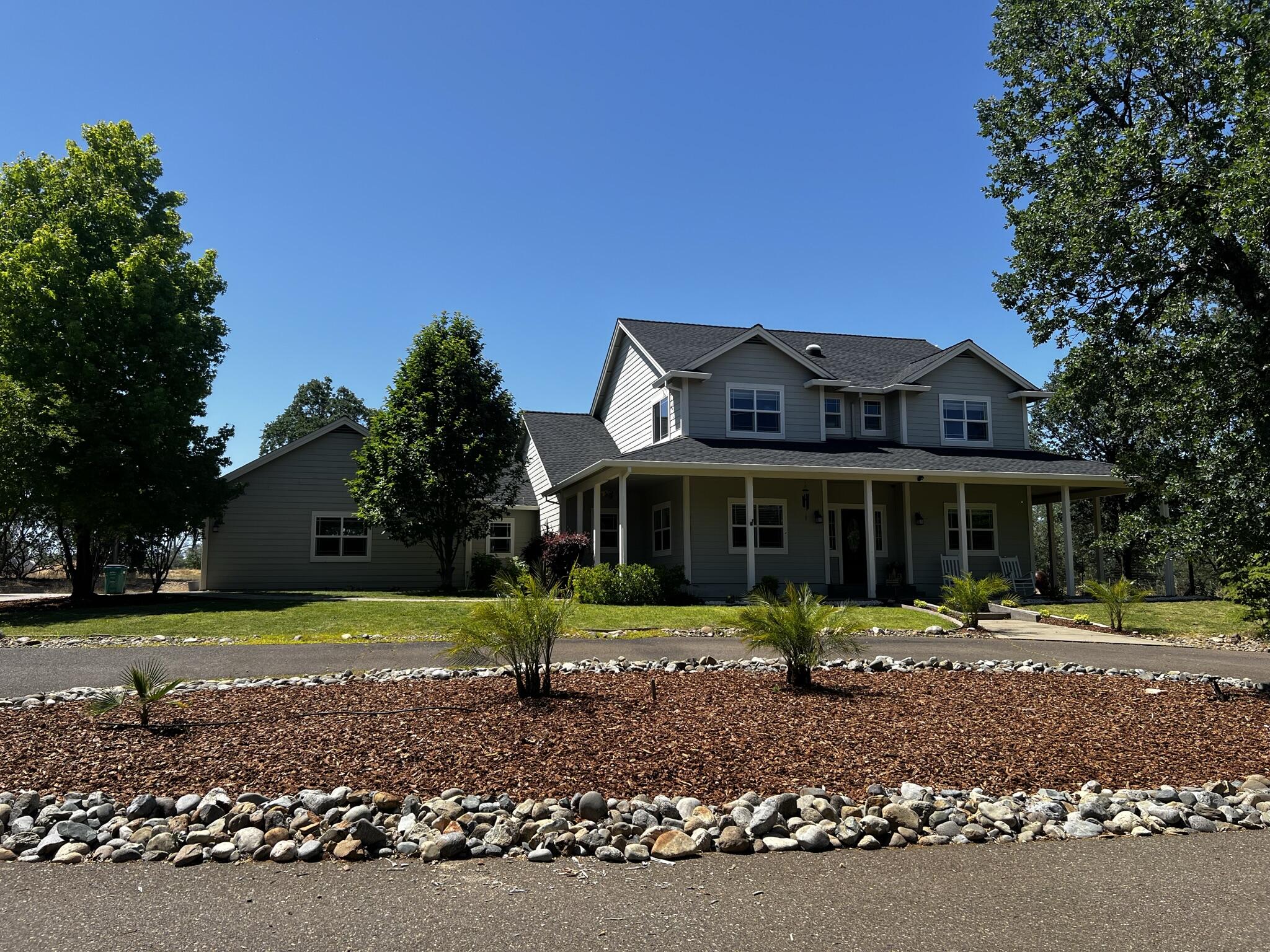 20901 Old 44 Drive Redding, CA 96003 - Photo 6 of 59 a front view of a house with a yard