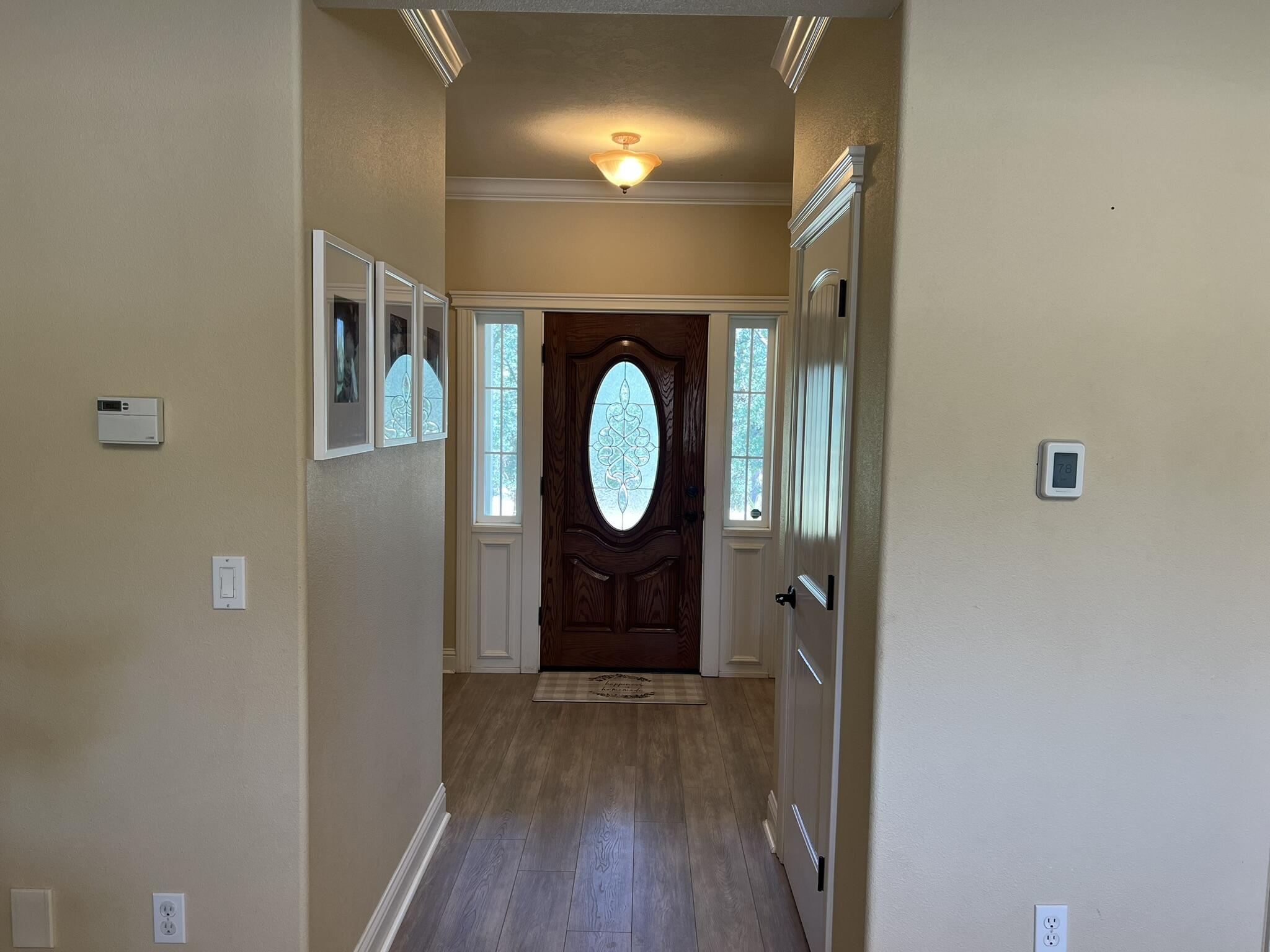 20901 Old 44 Drive Redding, CA 96003 - Photo 8 of 59 a view of a hallway with wooden floor