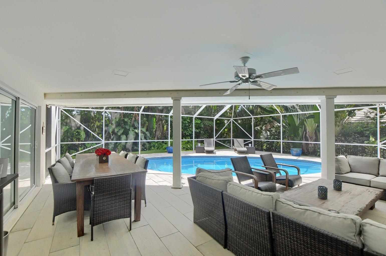 880 Hickory Terrace Boca Raton, FL 33486 - Photo 27 of 38 a living room with furniture and a large window