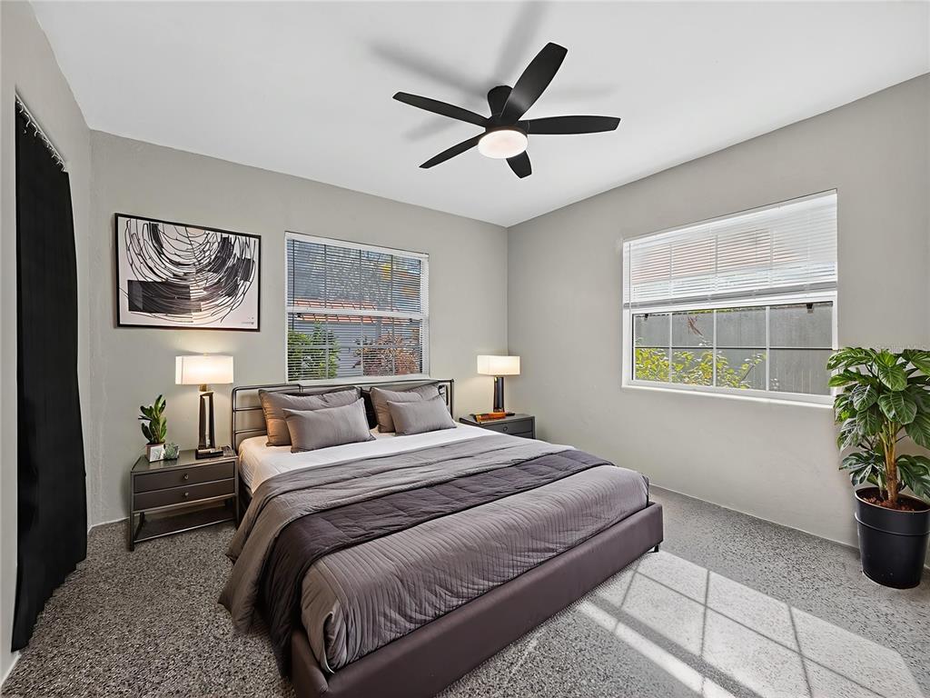 510 North Barrow Avenue Tavares, FL 32778 - Photo 13 of 33 a bedroom with a bed and a window