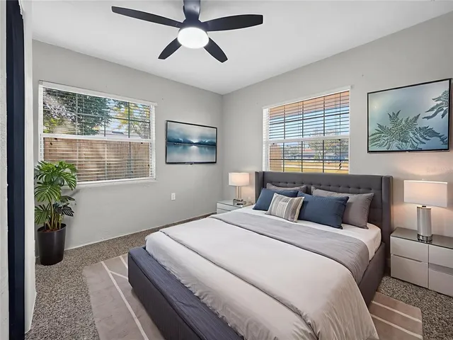 a bedroom with bed and window