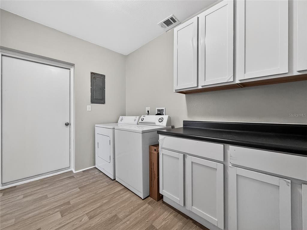 510 North Barrow Avenue Tavares, FL 32778 - Photo 20 of 33 a utility room with sink dryer and washer