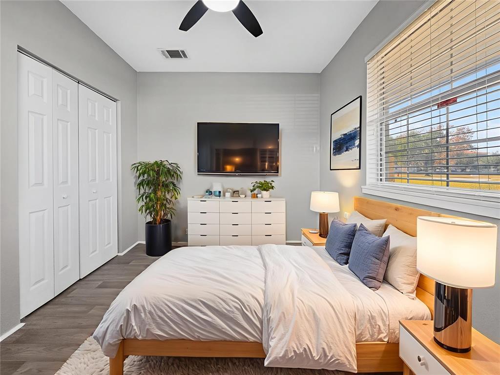 510 North Barrow Avenue Tavares, FL 32778 - Photo 23 of 33 a bedroom with a bed and a flat screen tv