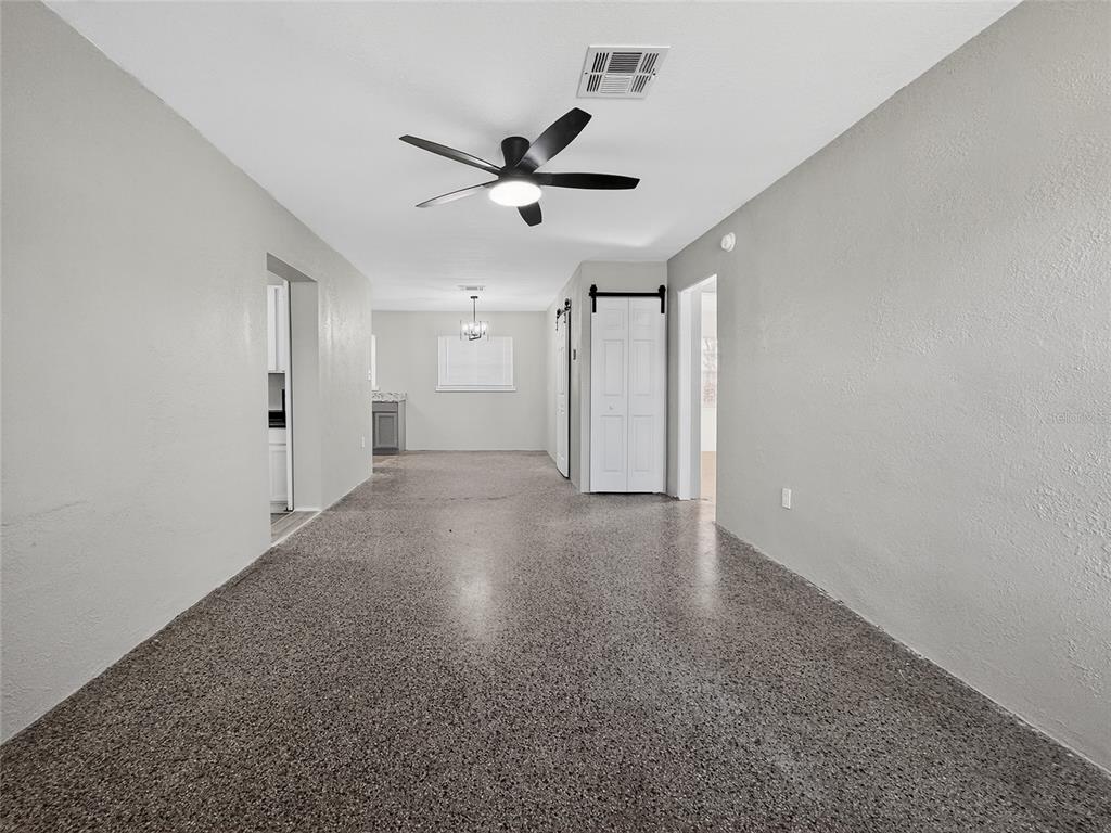 510 North Barrow Avenue Tavares, FL 32778 - Photo 6 of 33 a view of a livingroom with a ceiling fan and window