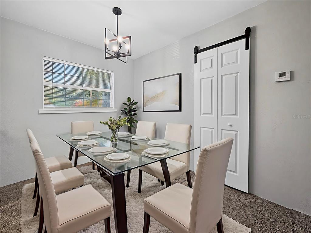 510 North Barrow Avenue Tavares, FL 32778 - Photo 8 of 33 a view of a dining room with furniture window and wooden floor