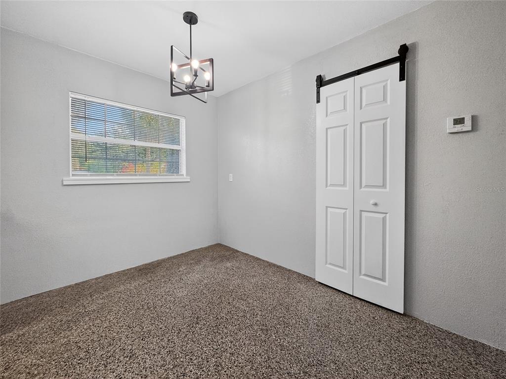 510 North Barrow Avenue Tavares, FL 32778 - Photo 9 of 33 a view of an entryway with window