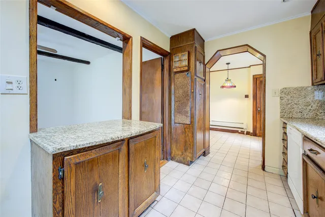 a view of a kitchen cabinets and a wooden floor