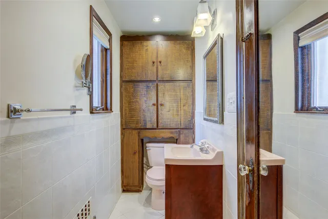 a bathroom with a mirror and a shower