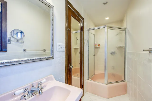 a bathroom with a tub and a sink