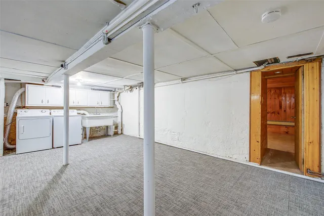 a view of a room with wooden walls