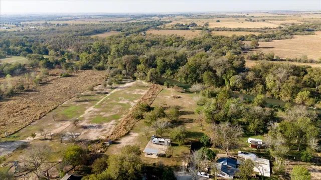 an aerial view of a town with trees