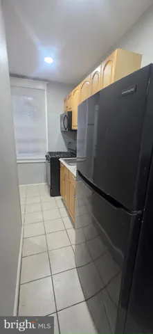 a kitchen with stainless steel appliances a sink and a counter top space