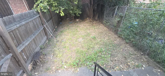 a view of backyard with green space
