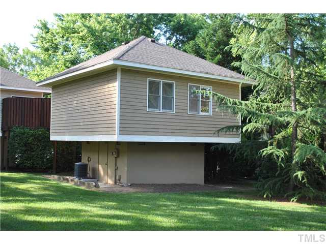 3322 Mill Run Raleigh, NC 27612 - Photo 2 of 16 a front view of a house with a yard