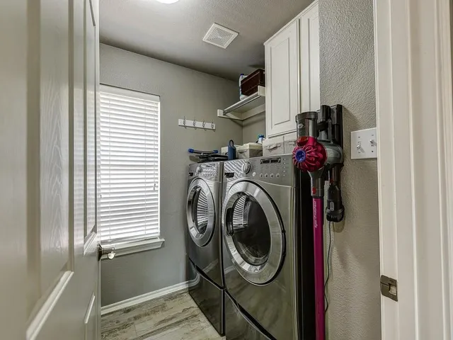 a utility room with dryer and washer