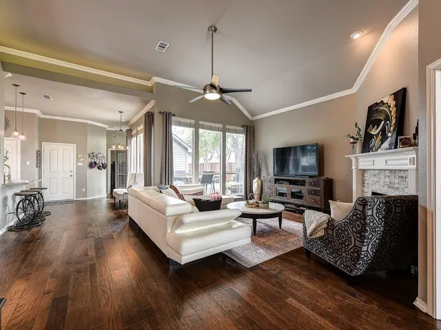a living room with fireplace furniture and a flat screen tv