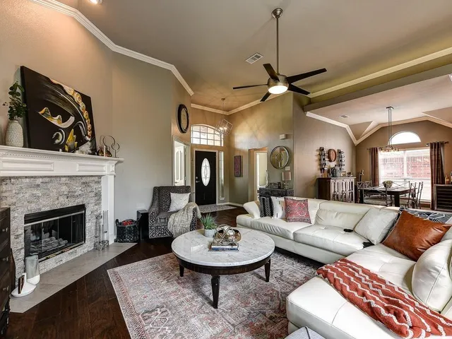 a living room with furniture and a fireplace
