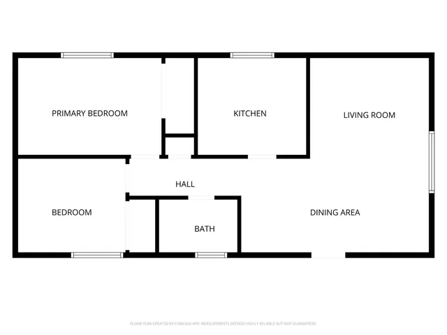 a picture of a wall with a white building