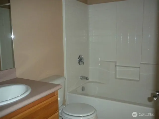 a bathroom with a sink a toilet and bathtub