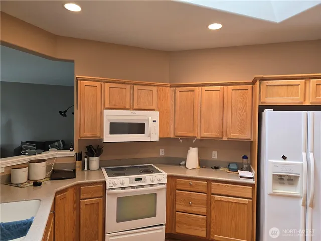 a kitchen with a stove and a microwave