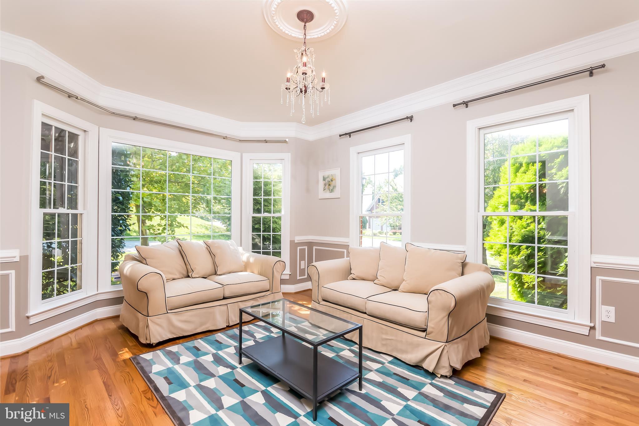 43268 Hillhead Place Leesburg, VA 20176 - Photo 13 of 53 a living room with furniture and a large window