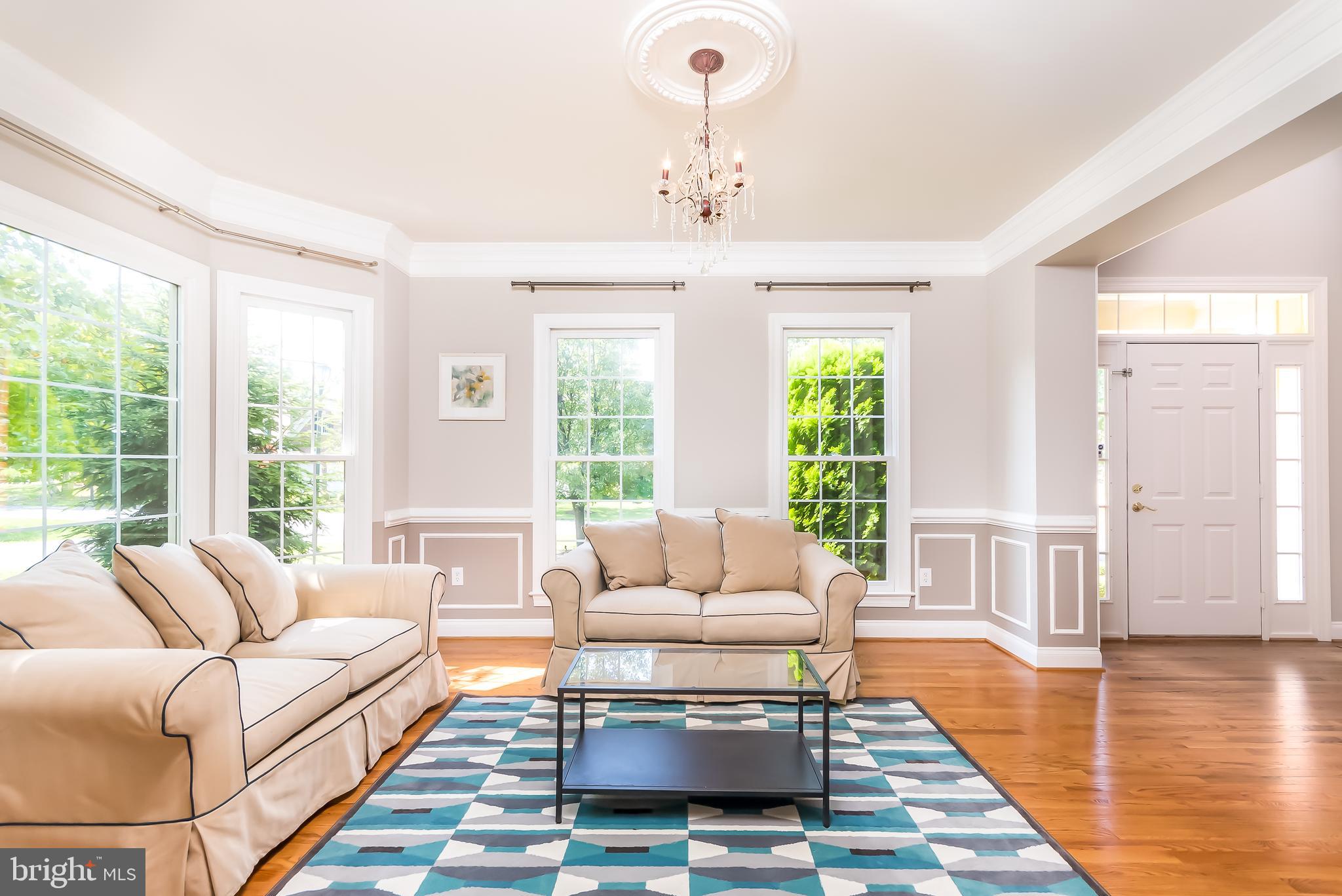 43268 Hillhead Place Leesburg, VA 20176 - Photo 14 of 53 a living room with furniture and a large window