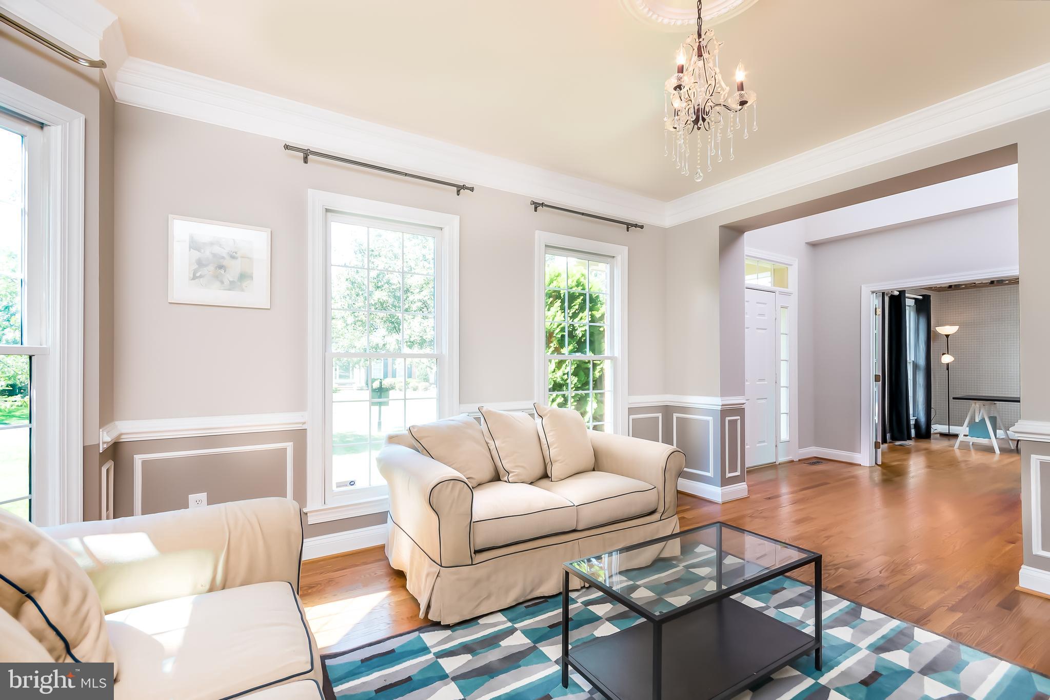 43268 Hillhead Place Leesburg, VA 20176 - Photo 15 of 53 a living room with furniture and a large window