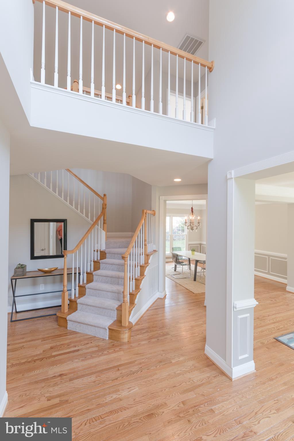 43268 Hillhead Place Leesburg, VA 20176 - Photo 16 of 53 a view of entryway and hall with wooden floor