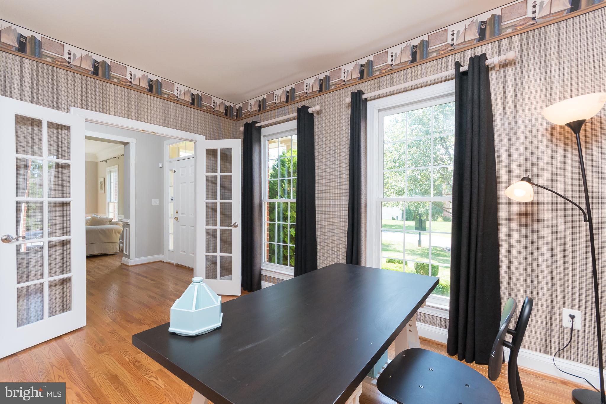 43268 Hillhead Place Leesburg, VA 20176 - Photo 18 of 53 a view of a dining room with furniture and wooden floor