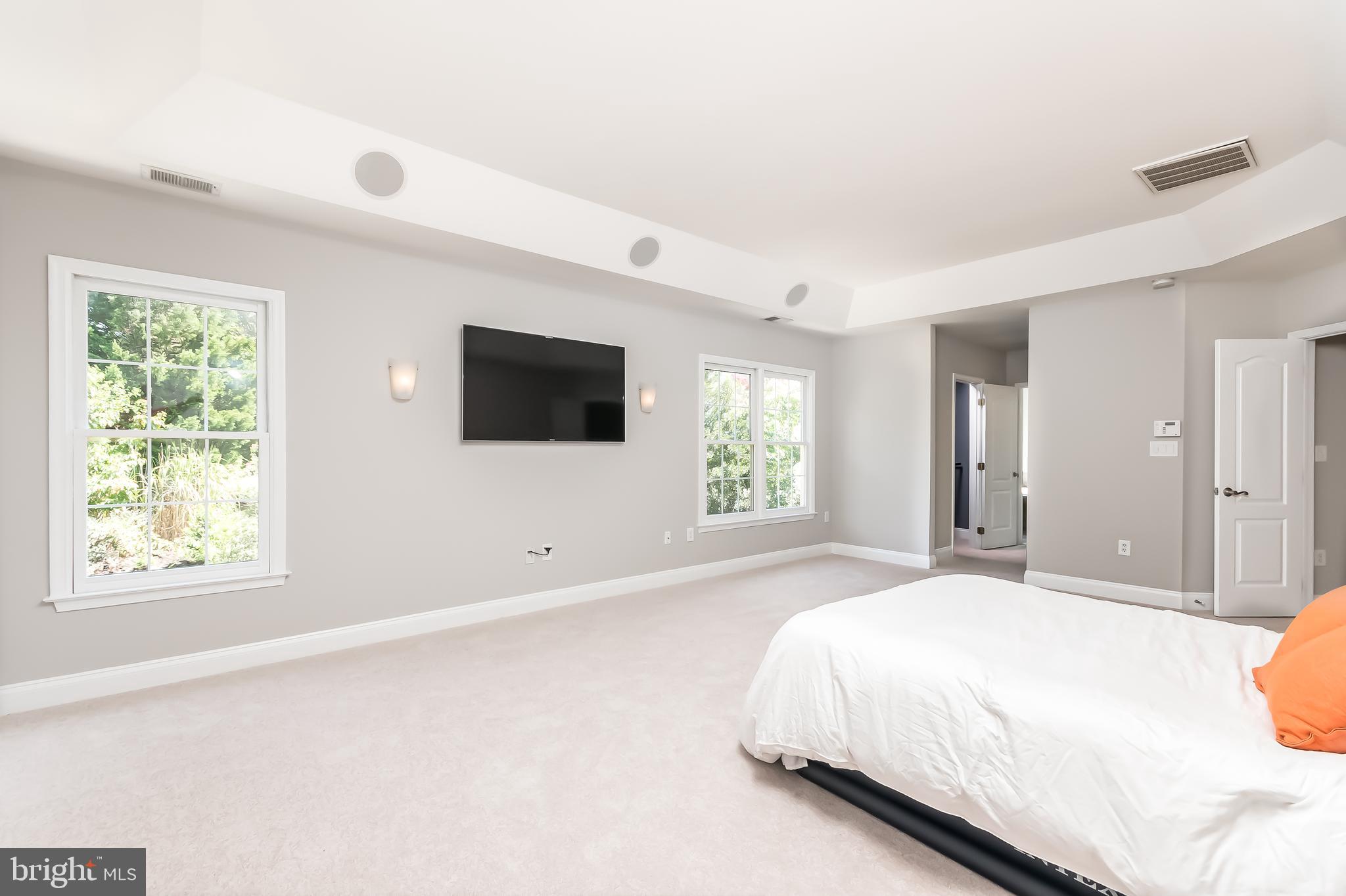 43268 Hillhead Place Leesburg, VA 20176 - Photo 21 of 53 a spacious bedroom with a bed and a window