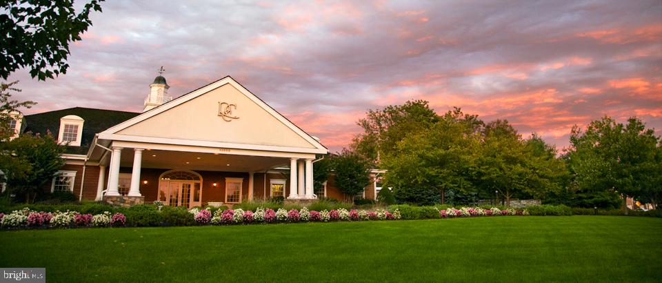 43268 Hillhead Place Leesburg, VA 20176 - Photo 48 of 53 a front view of a house with a garden and plants