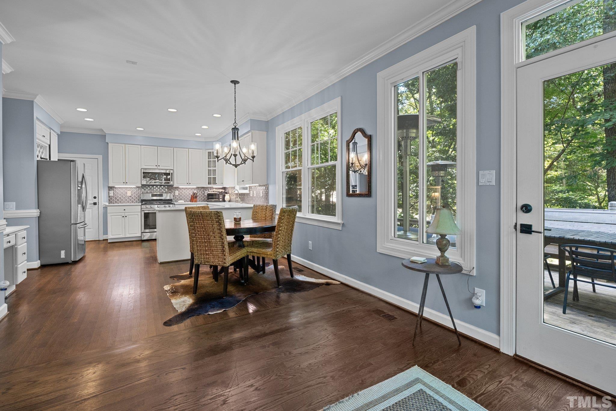 9 Montcrest Drive Durham, NC 27713 - Photo 18 of 43 a view of a dining room with furniture window and outside view