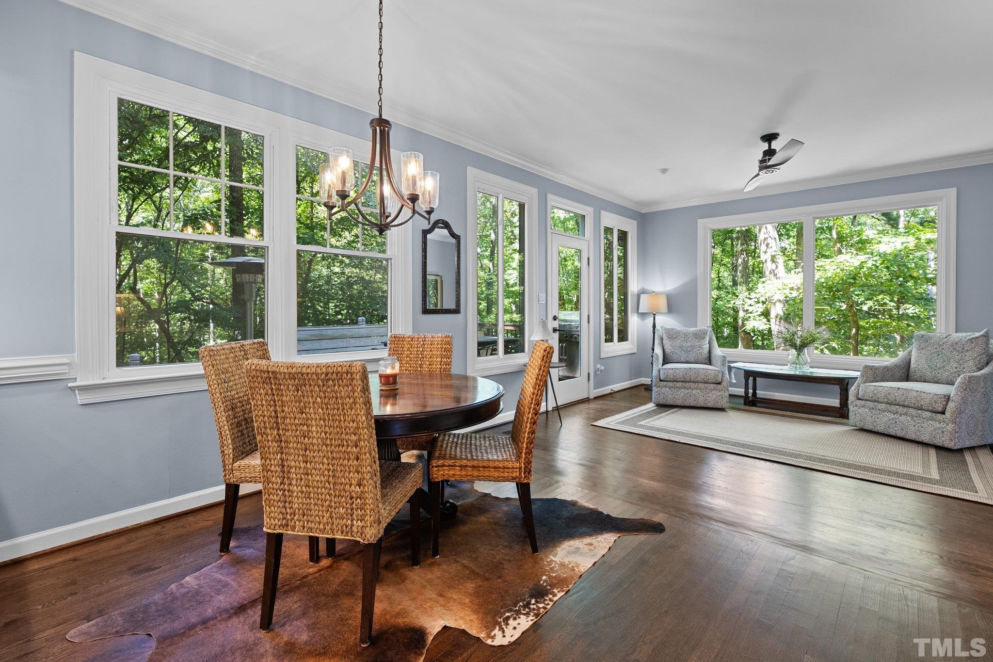 9 Montcrest Drive Durham, NC 27713 - Photo 19 of 43 a dining room with furniture large windows and wooden floor