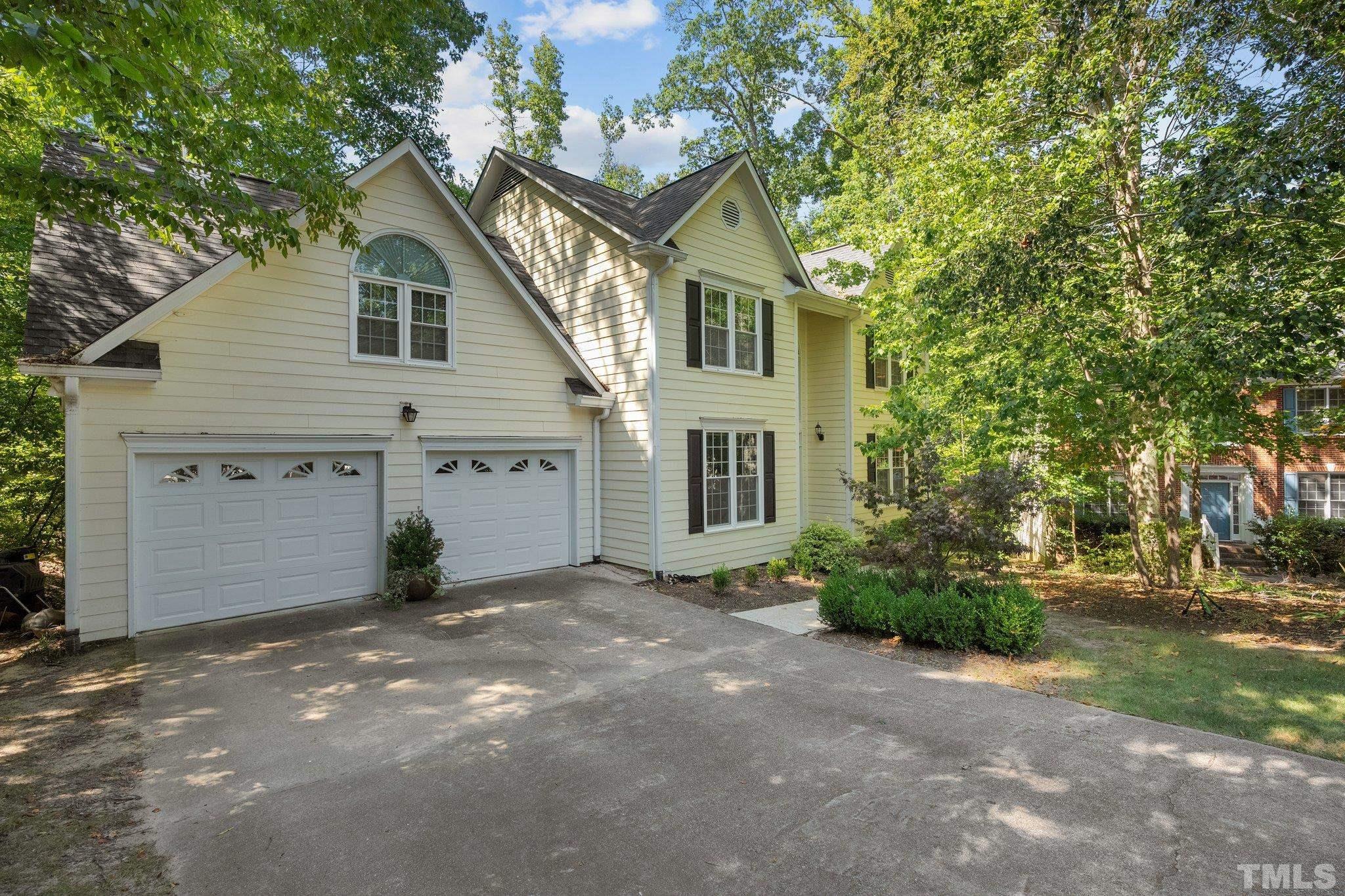 9 Montcrest Drive Durham, NC 27713 - Photo 2 of 43 a view of a house with a yard and garage