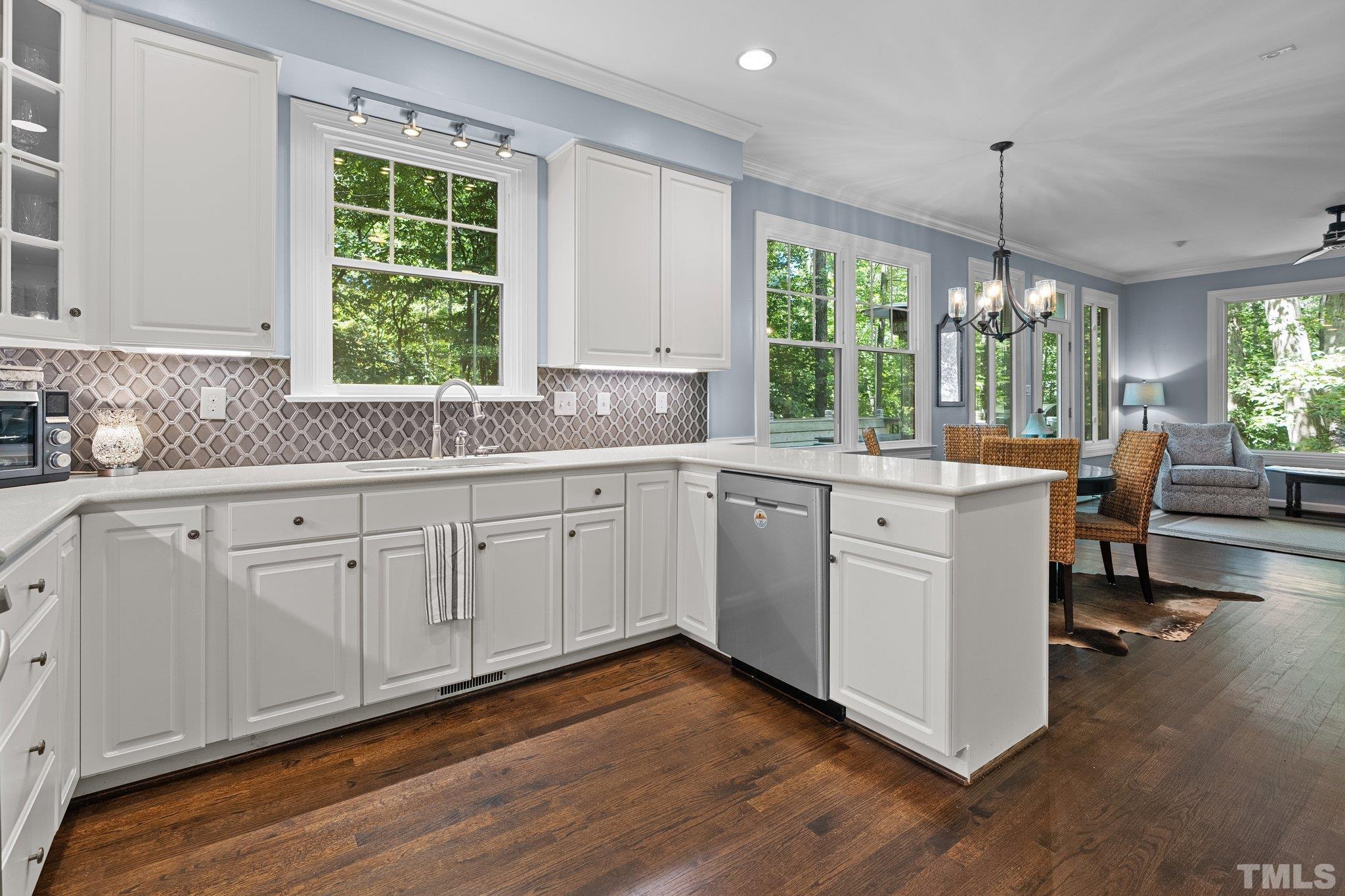 9 Montcrest Drive Durham, NC 27713 - Photo 22 of 43 a kitchen with sink cabinets and wooden floor