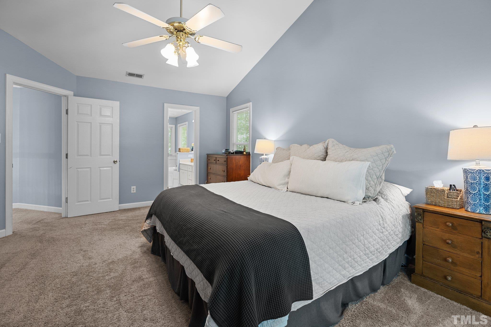 9 Montcrest Drive Durham, NC 27713 - Photo 29 of 43 a bedroom with a bed and a chandelier