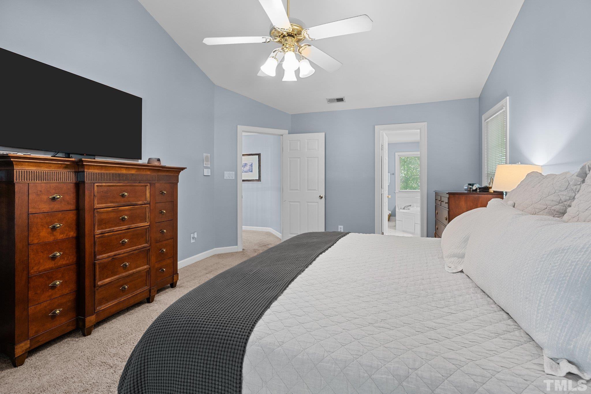 9 Montcrest Drive Durham, NC 27713 - Photo 30 of 43 a bedroom with a bed and a flat screen tv