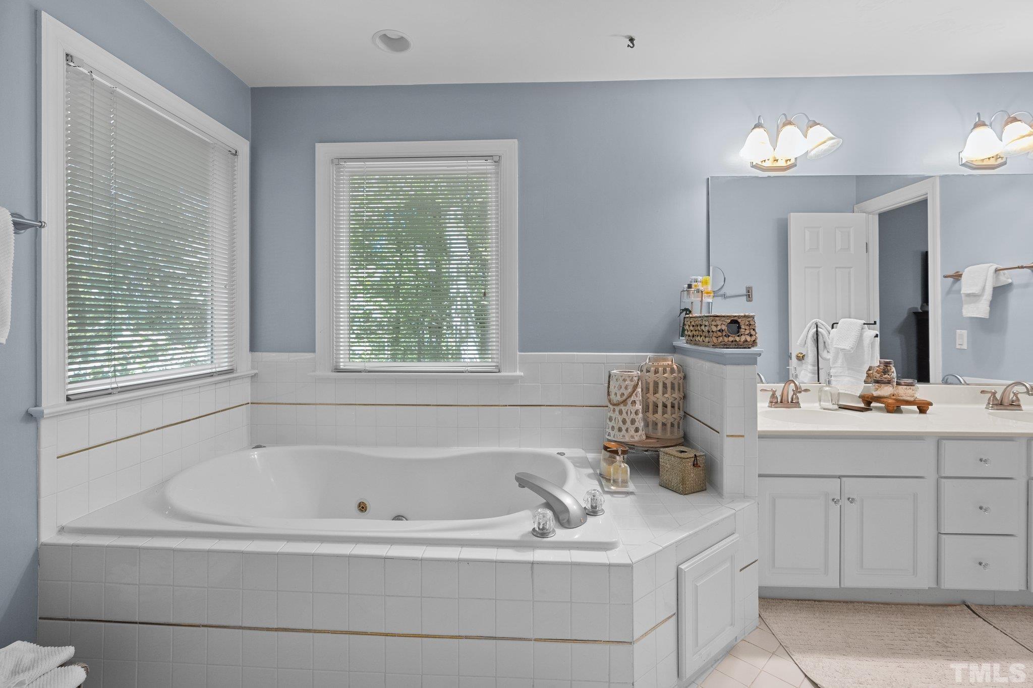 9 Montcrest Drive Durham, NC 27713 - Photo 32 of 43 a bathroom with a tub sink and mirror