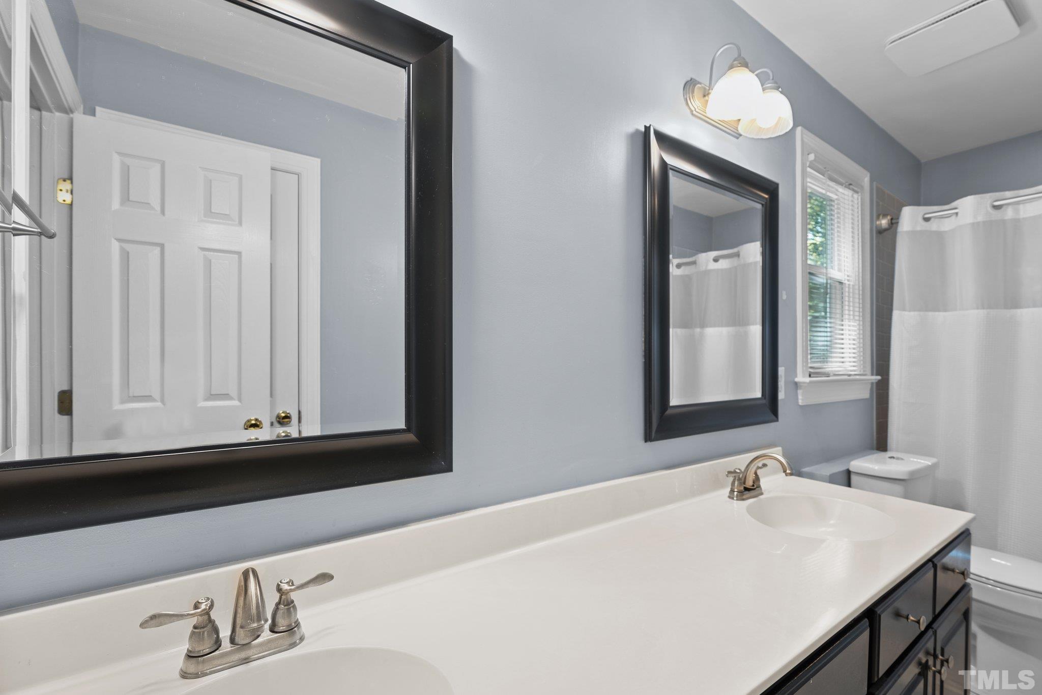 9 Montcrest Drive Durham, NC 27713 - Photo 34 of 43 a bathroom with a sink and a mirror
