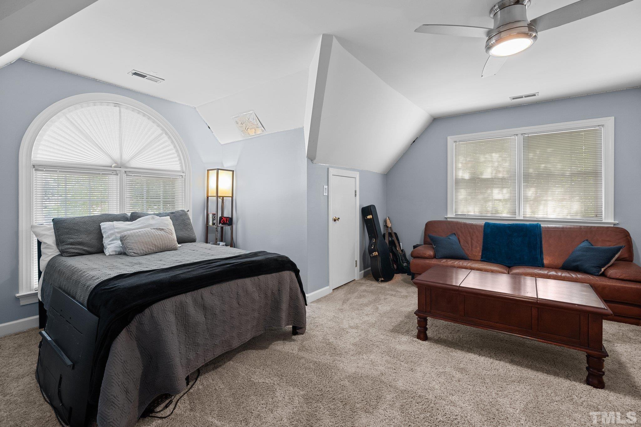 9 Montcrest Drive Durham, NC 27713 - Photo 37 of 43 a bedroom with a bed couch and window