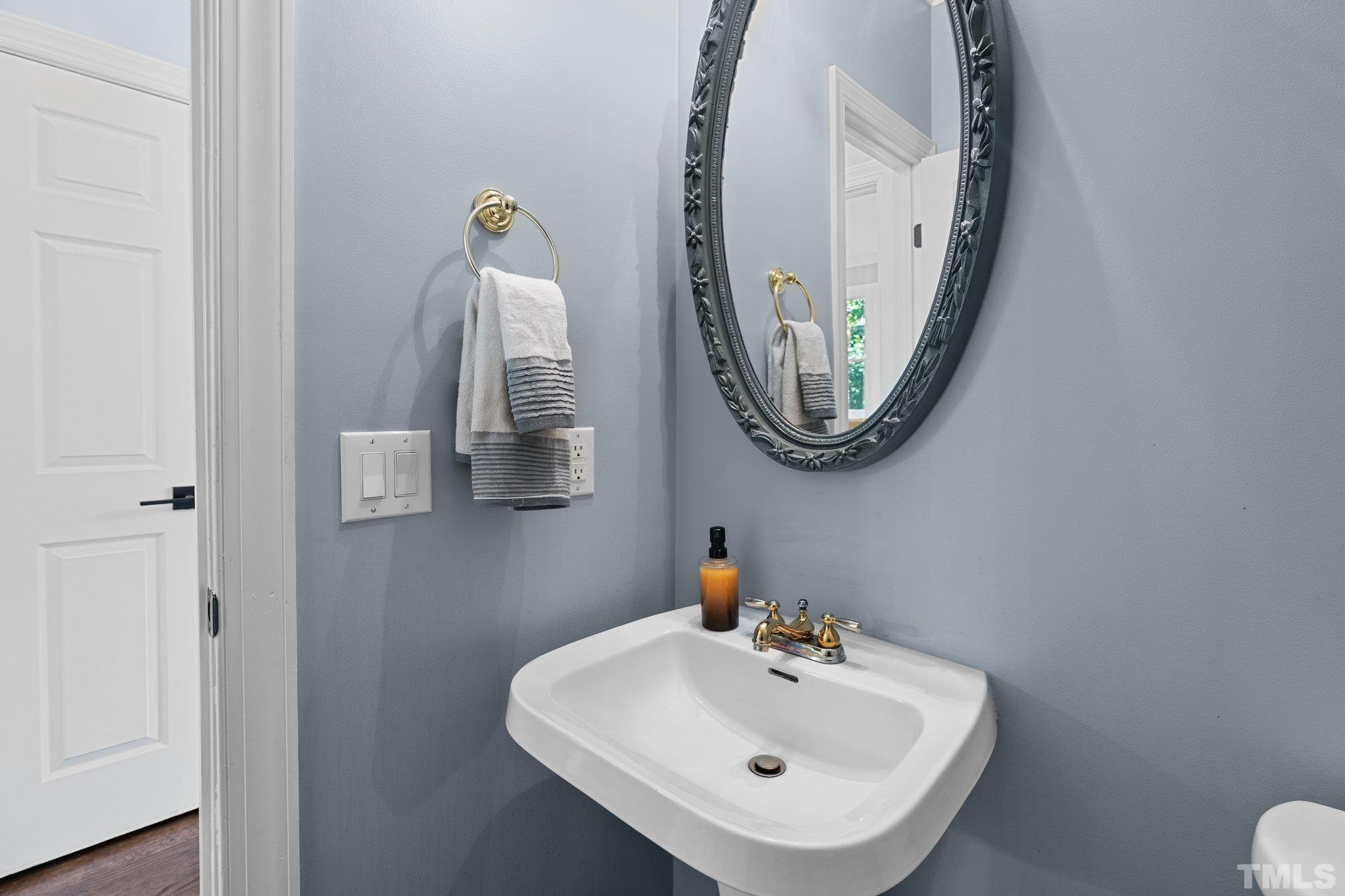 9 Montcrest Drive Durham, NC 27713 - Photo 8 of 43 a bathroom with a sink and mirror