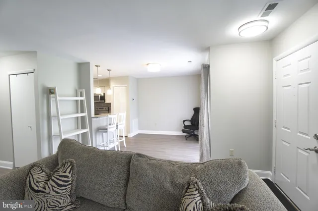 a living room with furniture and a area