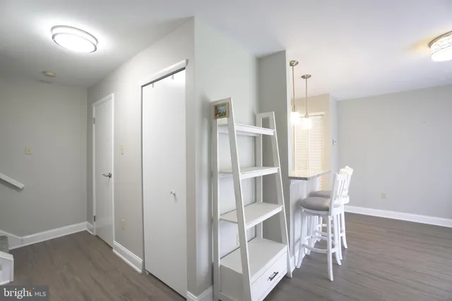 a view of kitchen with furniture and wooden floor