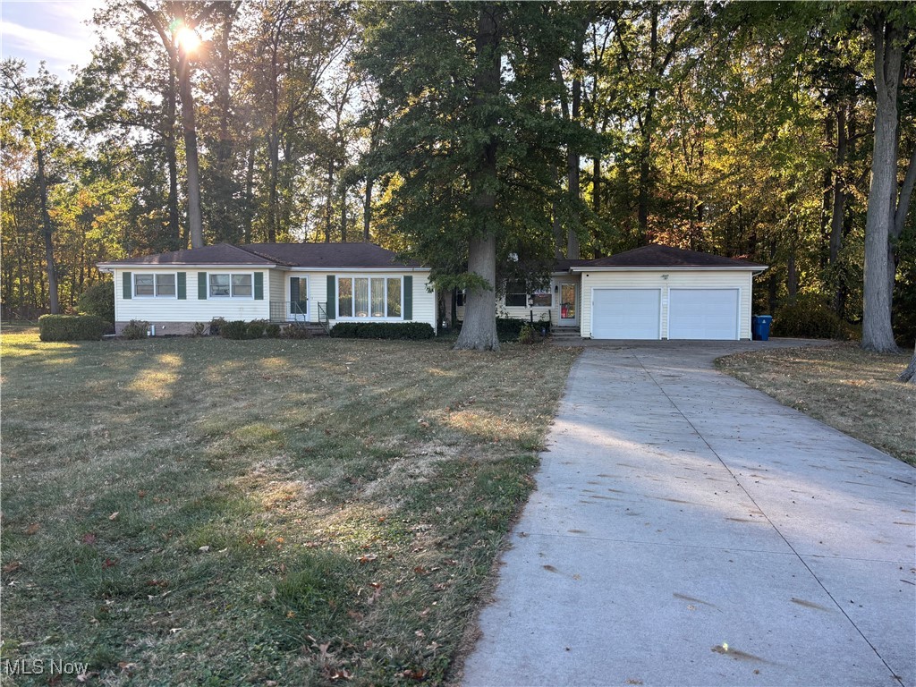 1900 Jaycox Road Avon, OH 44011 - Photo 1 of 26 Ranch-style house with concrete driveway and a front lawn