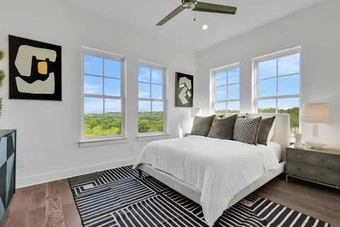 a bedroom with double bed and a window
