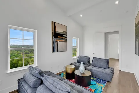 a living room with furniture and a large window